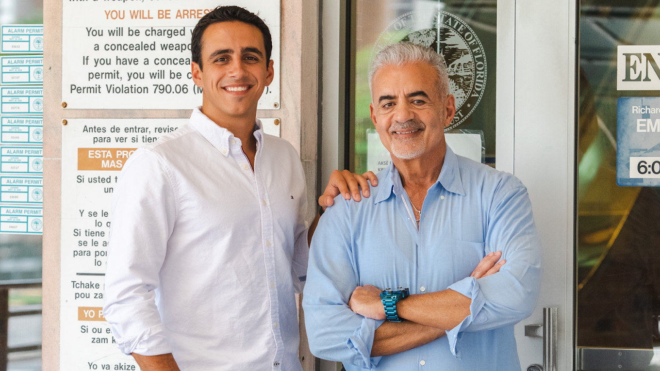 Gabriell Salgado and Emilio Faroy outside their Miami office — a father-and-son bail bond team